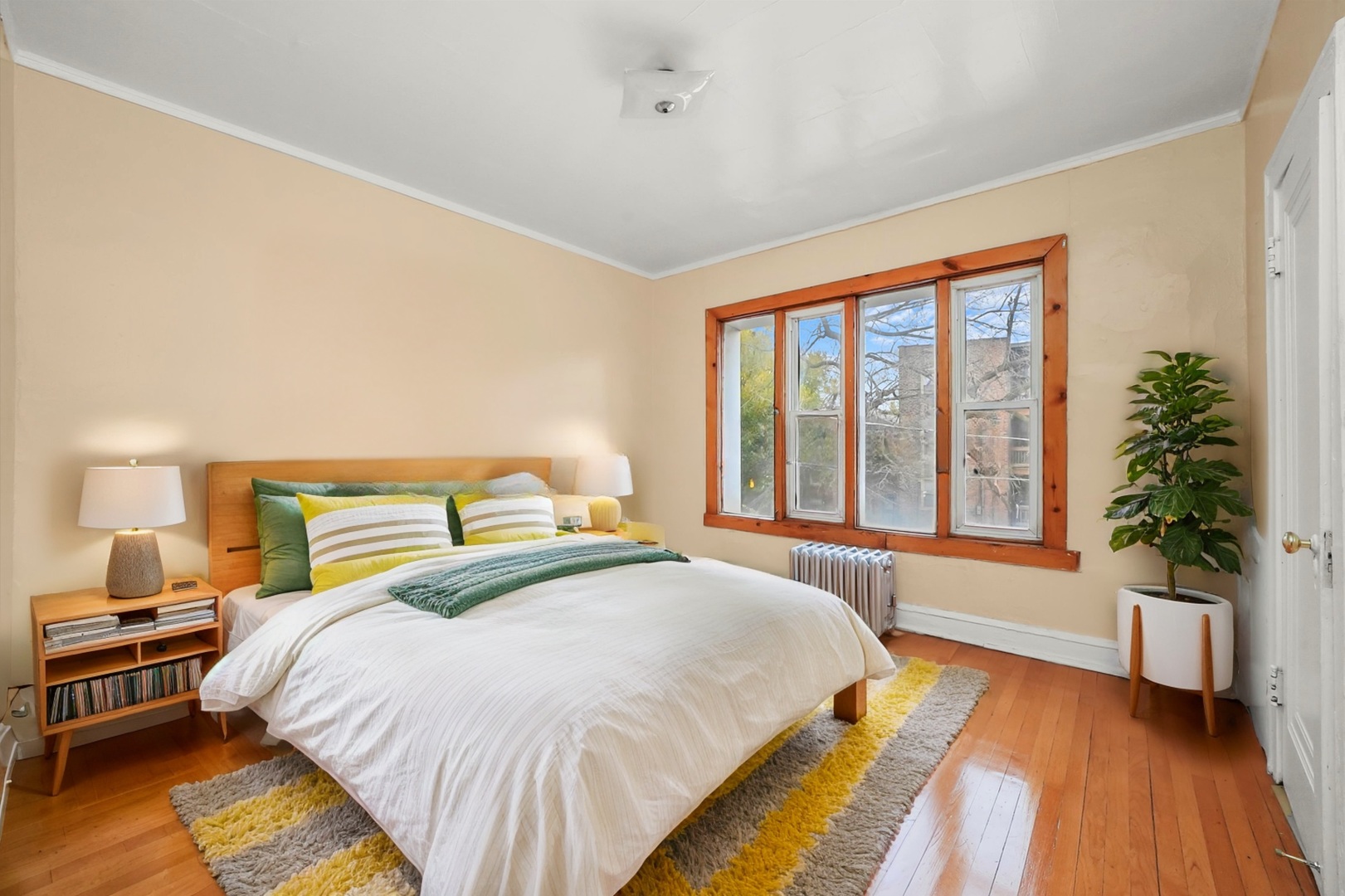 7825 South Phillips Avenue Chicago, IL 60649 - Photo 31 of 55 a bedroom with bed and a large window