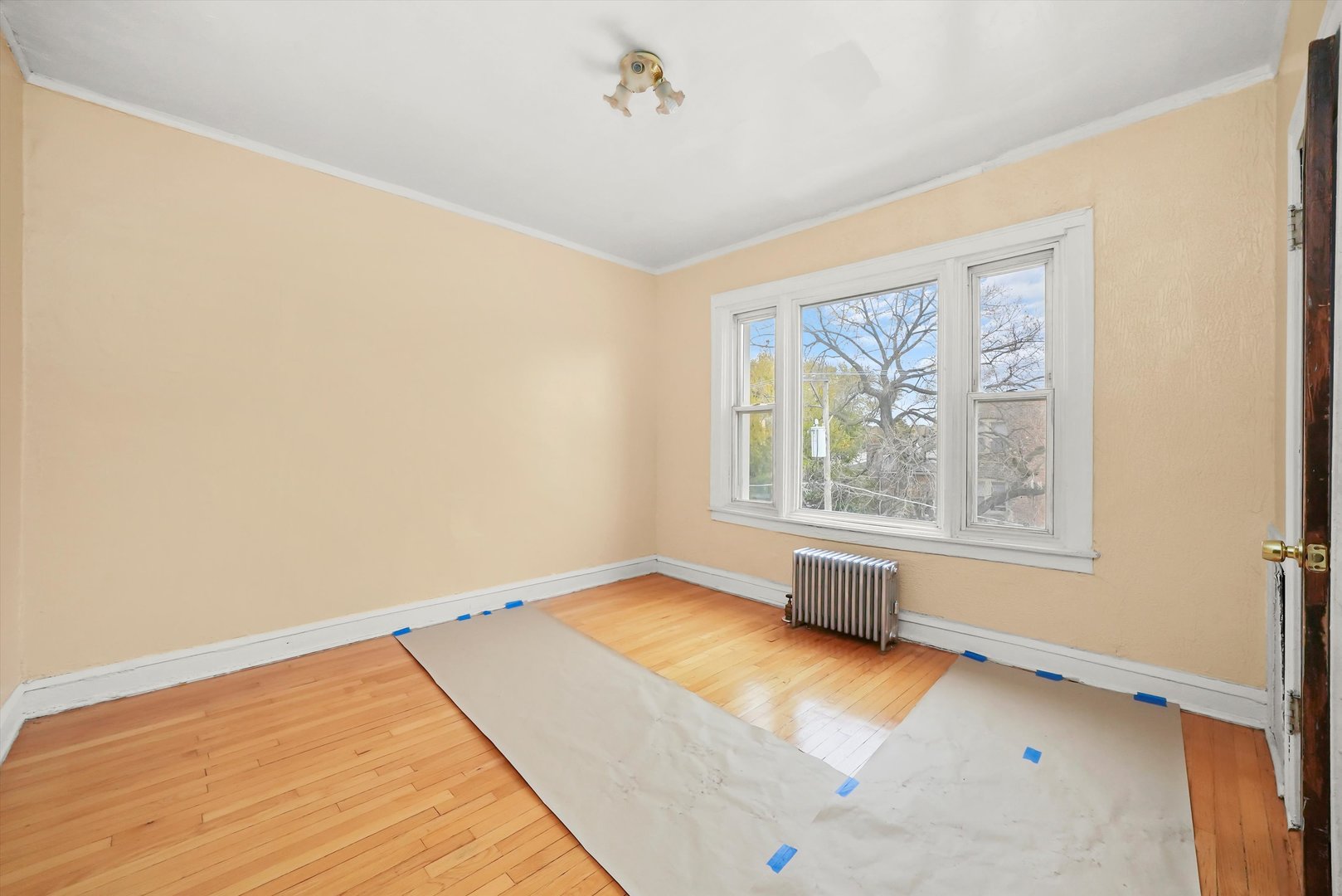 7825 South Phillips Avenue Chicago, IL 60649 - Photo 42 of 55 a view of room with window and wooden floor