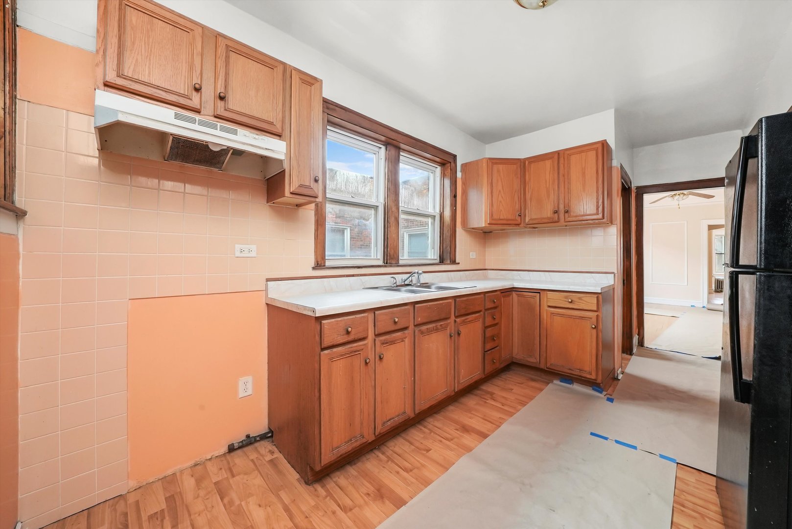 7825 South Phillips Avenue Chicago, IL 60649 - Photo 46 of 55 a kitchen with stainless steel appliances granite countertop a sink stove and refrigerator