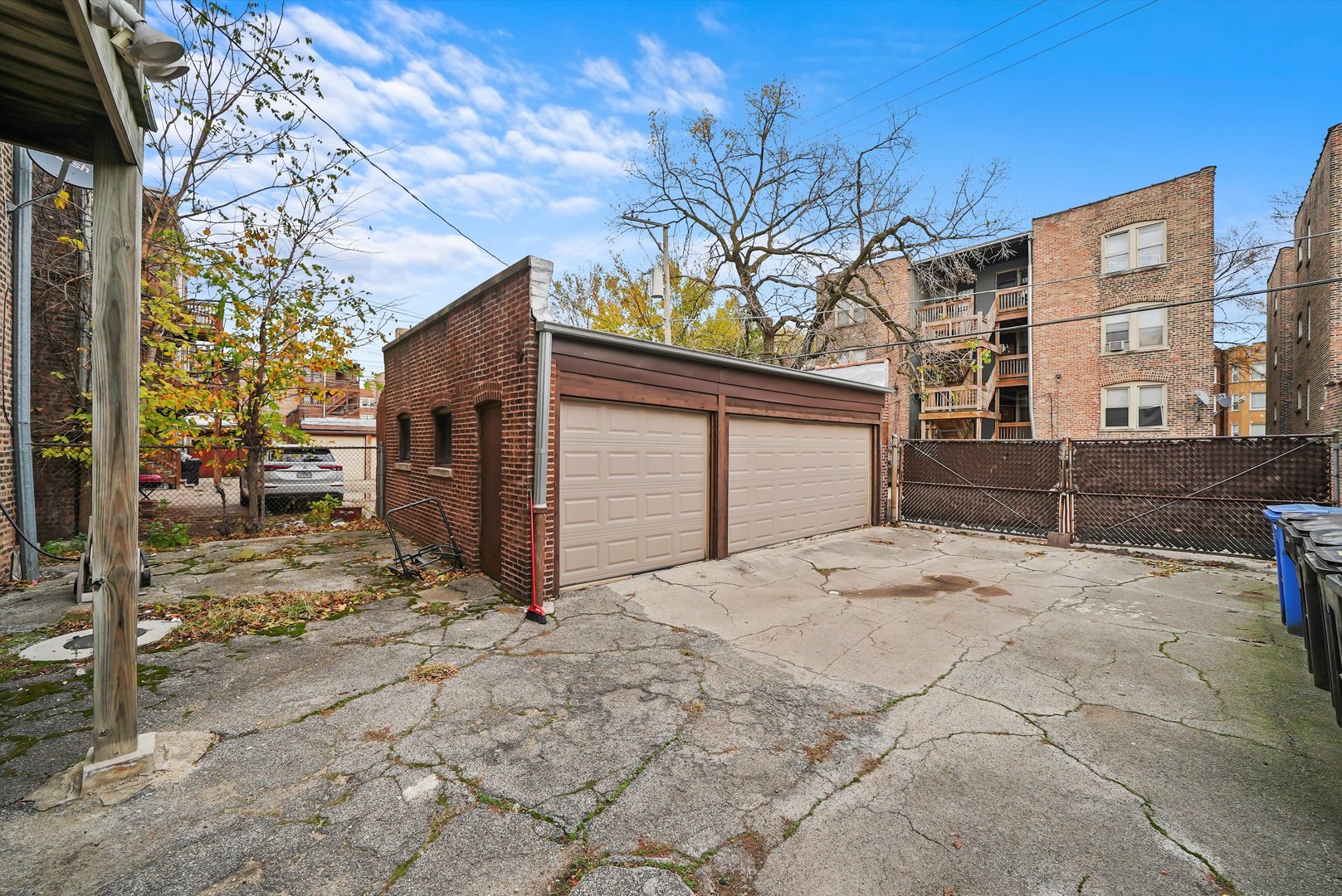 7825 South Phillips Avenue Chicago, IL 60649 - Photo 48 of 55 a view of a house with a snow in the yard