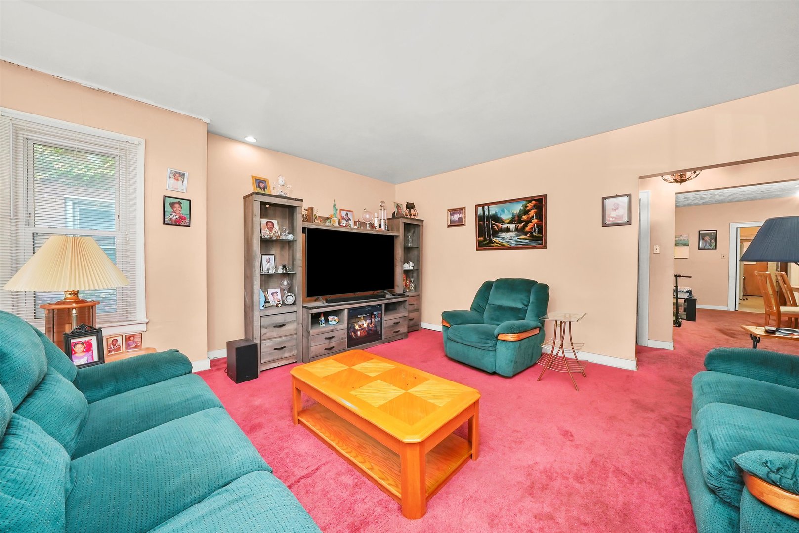7825 South Phillips Avenue Chicago, IL 60649 - Photo 5 of 55 a living room with furniture and a flat screen tv