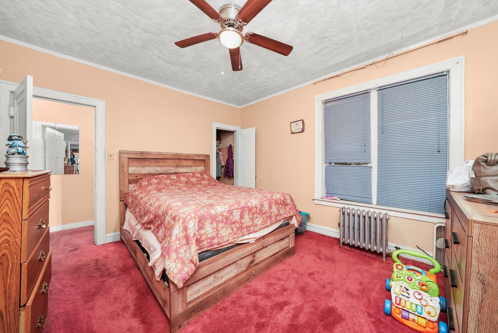 7825 South Phillips Avenue Chicago, IL 60649 - Photo 6 of 55 a bed room with a bed and a window
