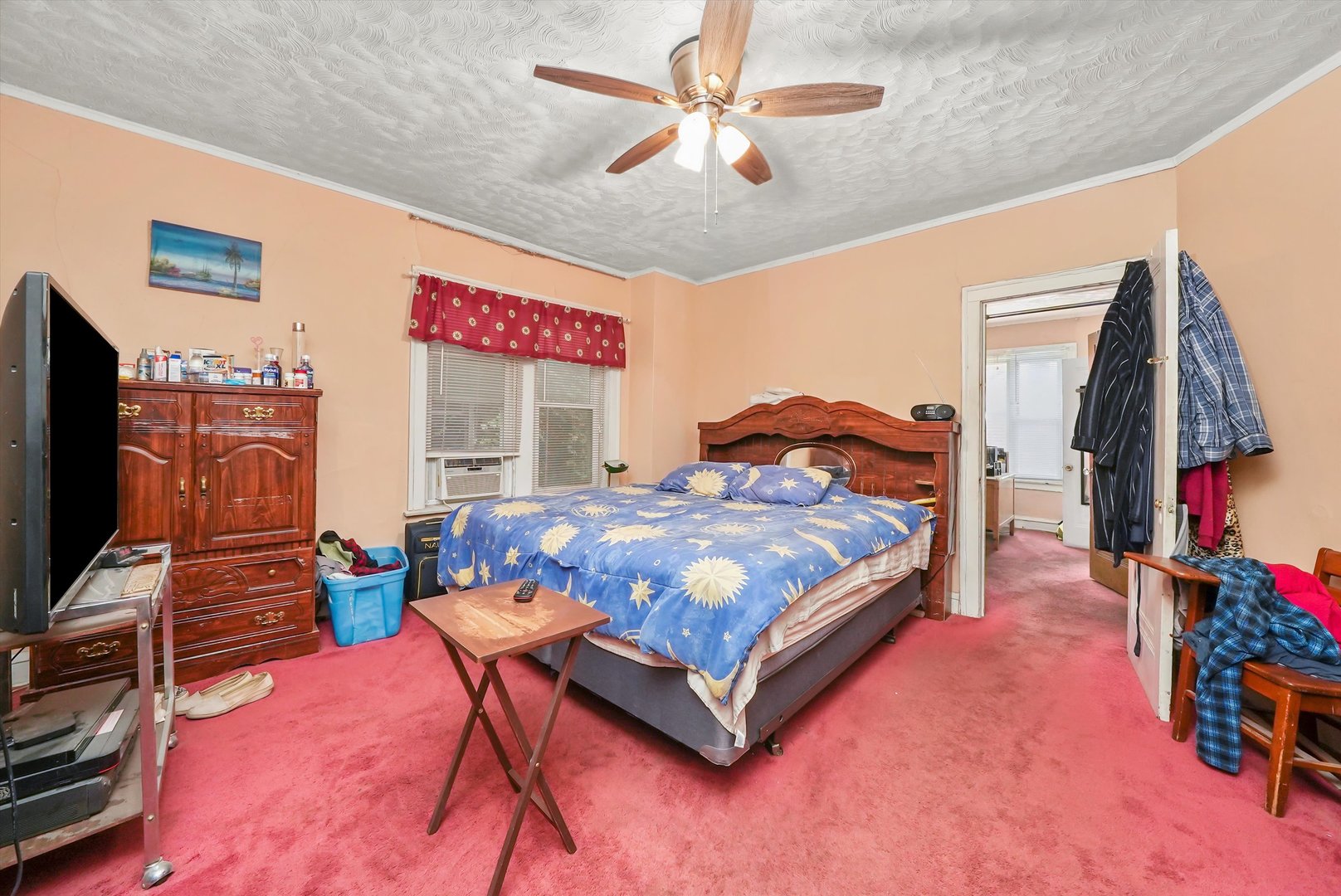 7825 South Phillips Avenue Chicago, IL 60649 - Photo 8 of 55 a bedroom with a bed and a flat screen tv