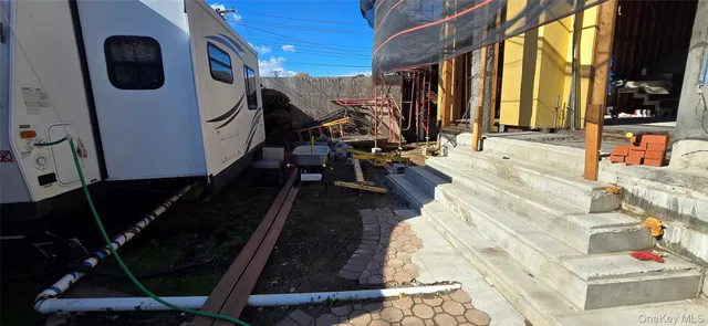 a view of a door with wooden fence