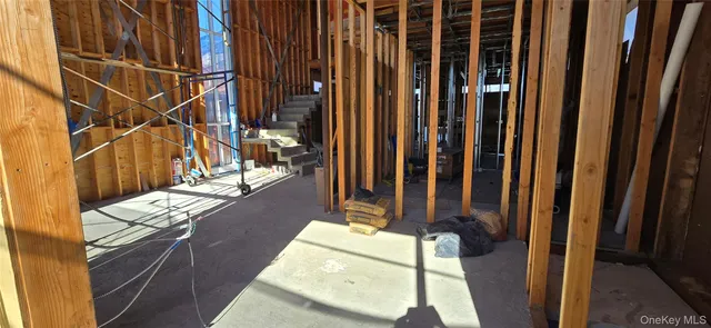 a view of a patio with table and chairs