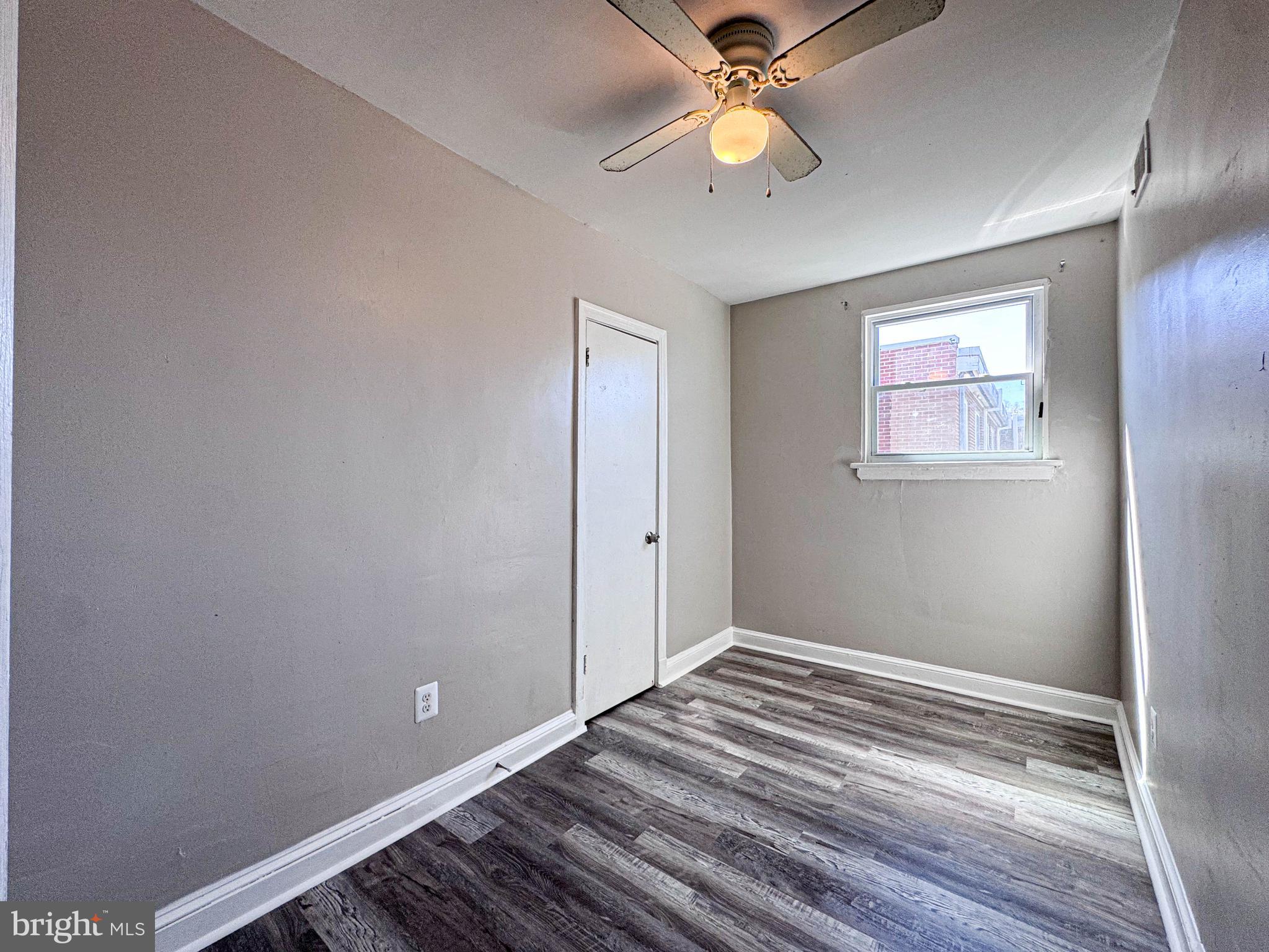 4630 Hillside Road Southeast, Unit 3 & 4 Washington, DC 20019 - Photo 11 of 23 wooden floor in an empty room with a window