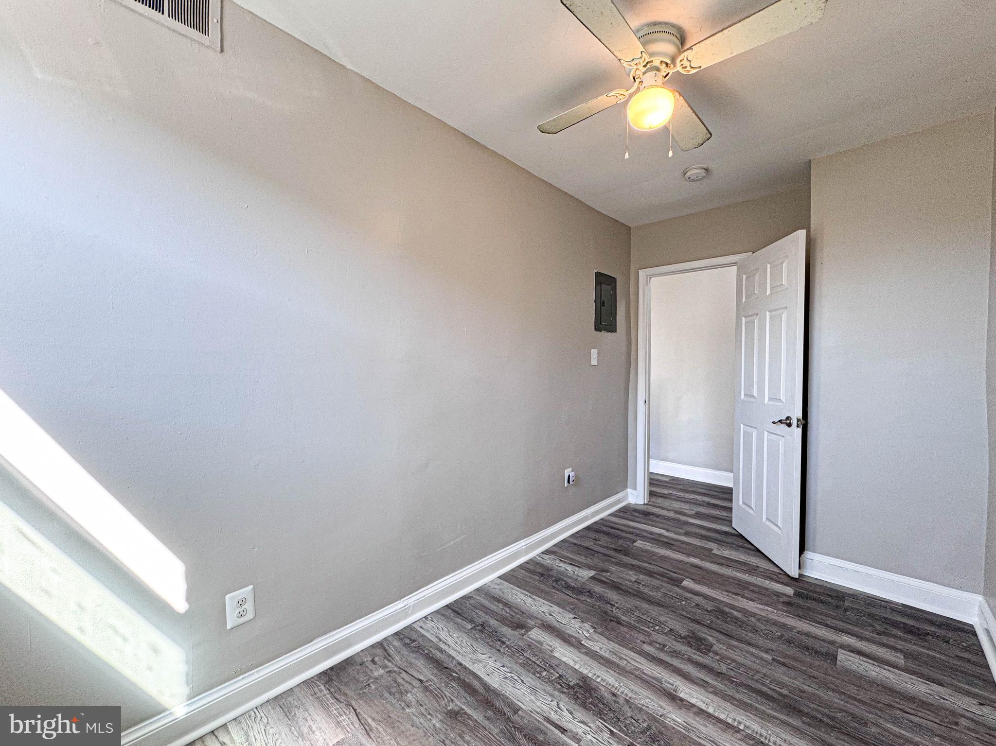 4630 Hillside Road Southeast, Unit 3 & 4 Washington, DC 20019 - Photo 12 of 23 wooden floor in an empty room with a window
