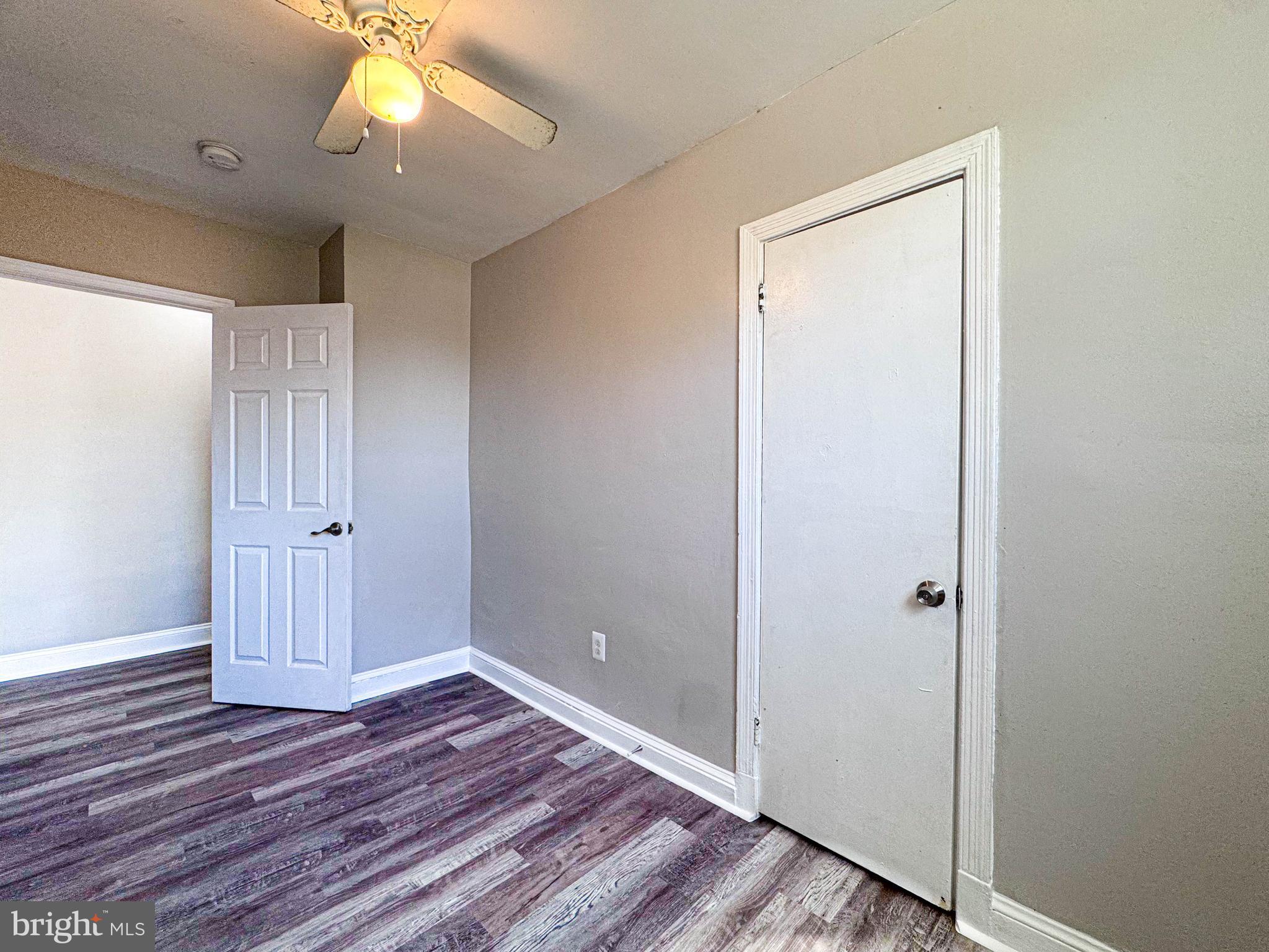 4630 Hillside Road Southeast, Unit 3 & 4 Washington, DC 20019 - Photo 13 of 23 a view of an empty room with wooden floor