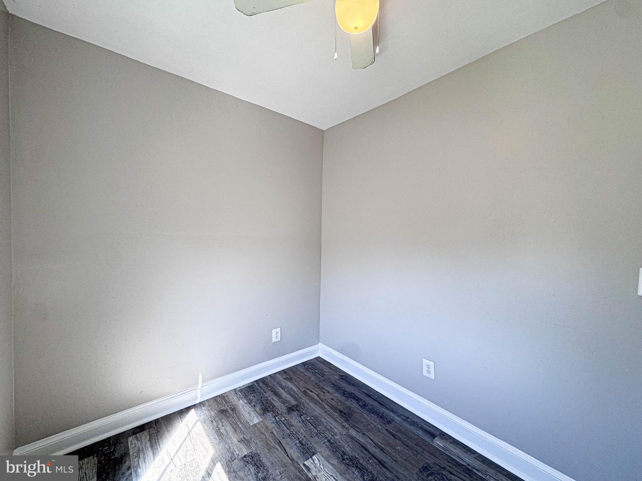 4630 Hillside Road Southeast, Unit 3 & 4 Washington, DC 20019 - Photo 15 of 23 a view of an empty room with wooden floor and a window