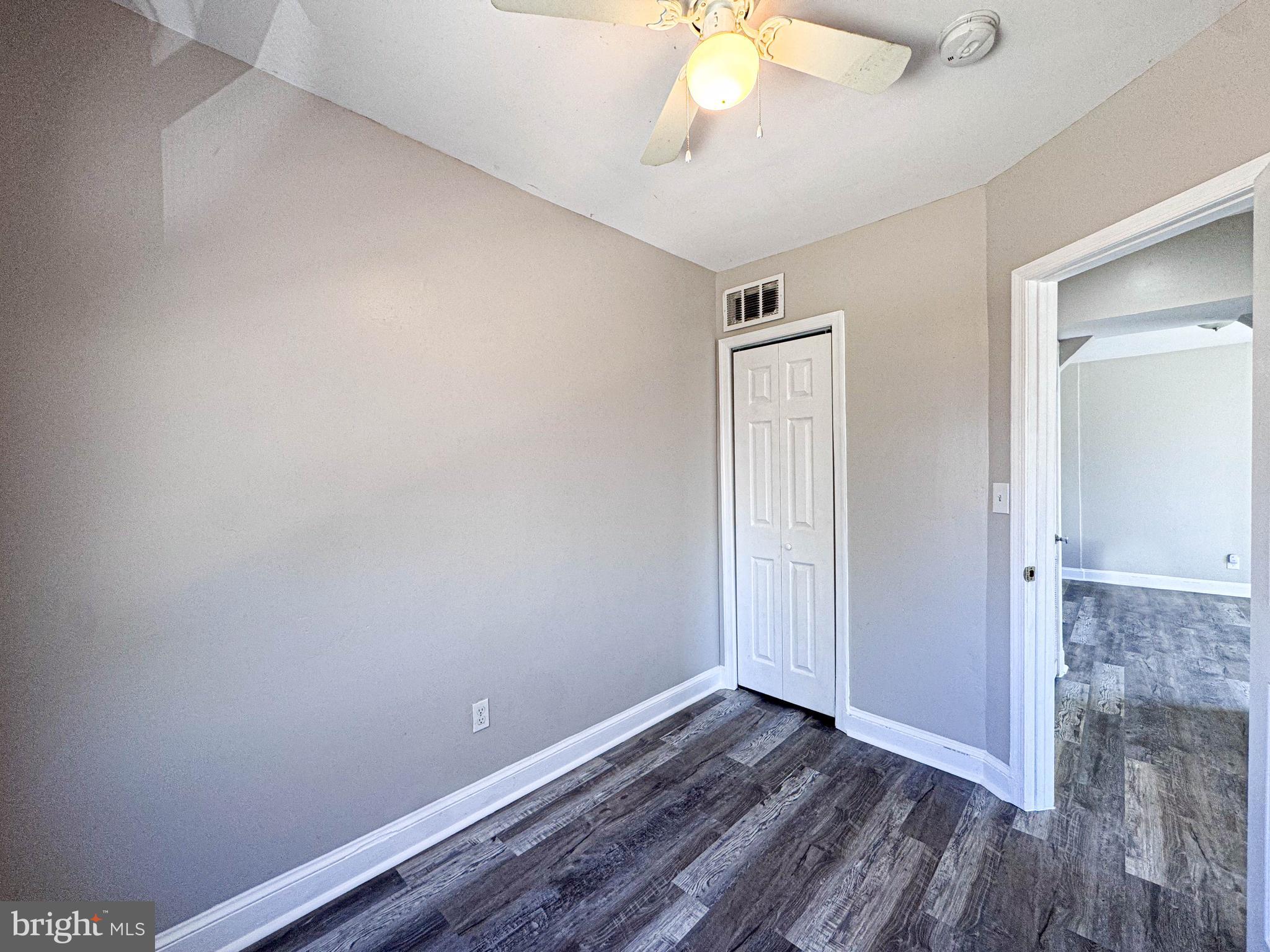 4630 Hillside Road Southeast, Unit 3 & 4 Washington, DC 20019 - Photo 19 of 23 a view of an empty room with wooden floor