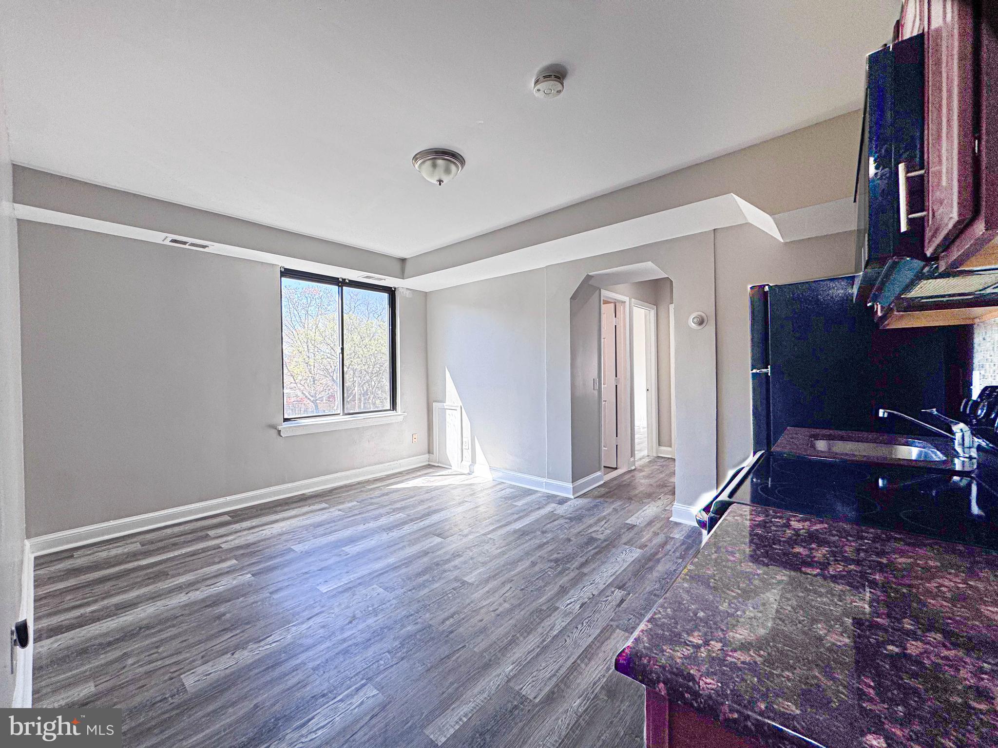 4630 Hillside Road Southeast, Unit 3 & 4 Washington, DC 20019 - Photo 7 of 23 a view of a livingroom with wooden floor and furniture