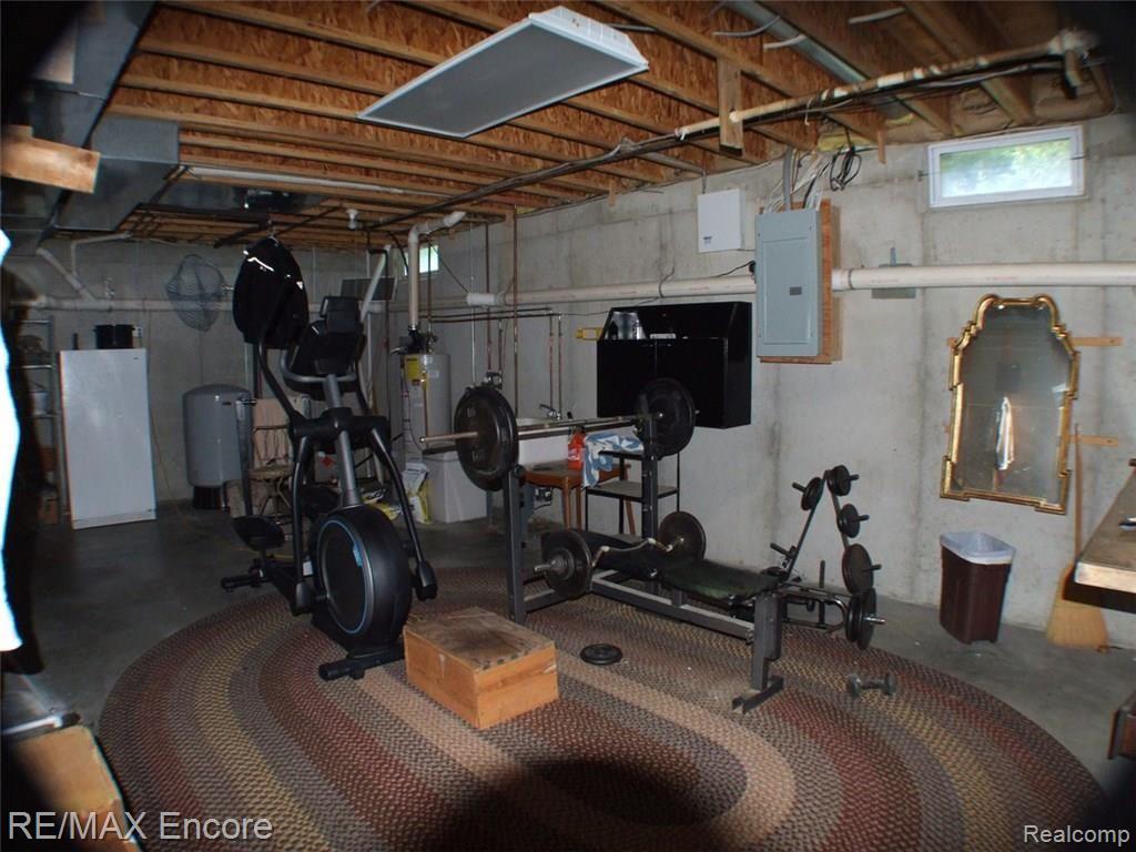 8945 Michigamme Road Clarkston, MI 48348 - Photo 26 of 30 Basement with high ceilings and space for exercise equipment