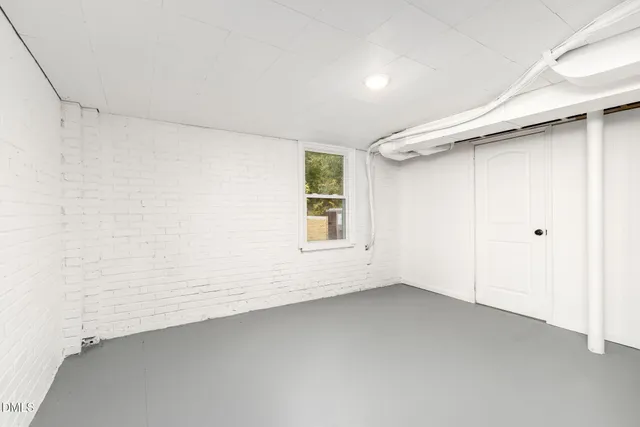 a spacious bathroom with a double vanity sink and a mirror