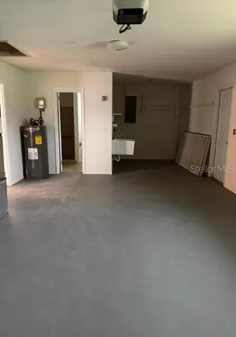 a view of a livingroom with furniture and a flat screen tv