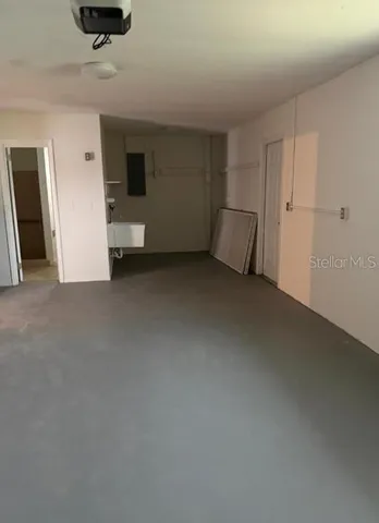 a view of an empty room and a window