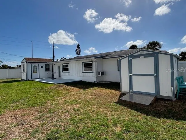 a view of a hallway with a chandelier