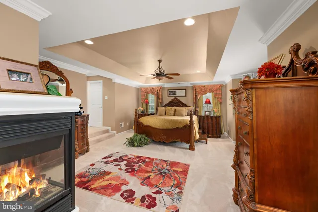 a bedroom with furniture and a fireplace