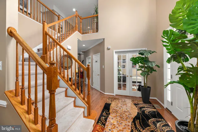 a view of entryway with wooden floor and a potted plant