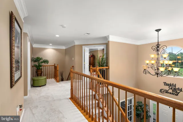 a view of a hallway view with staircase