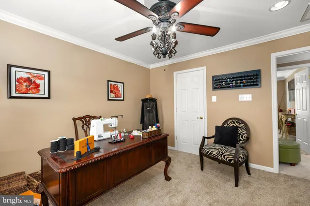 a bedroom with furniture and a ceiling fan