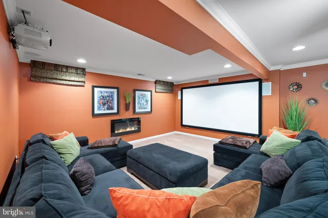 a living room with furniture a projector and a projector