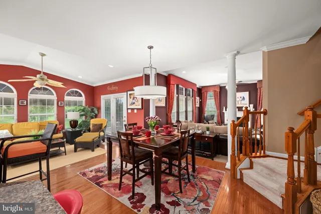 a living room filled with furniture and wooden floor