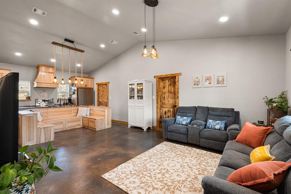 1501 Huddleston Road Sunset, TX 76270 - Photo 4 of 17 a living room with furniture and wooden floor