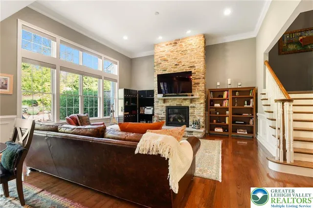 a living room with fireplace furniture and a flat screen tv