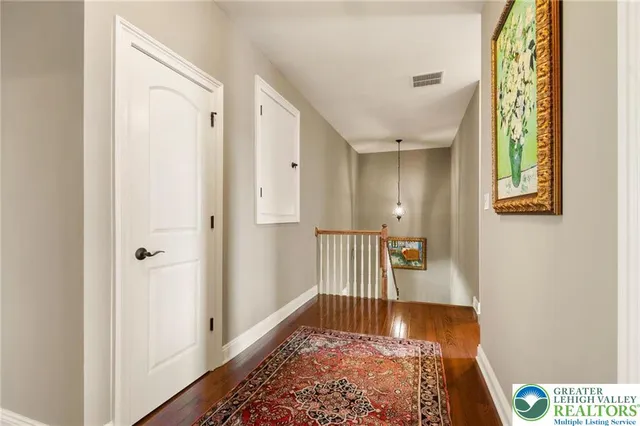 a view of entryway with wooden floor