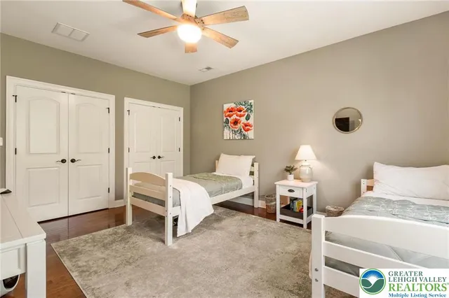 a bed room with a bed and a chandelier