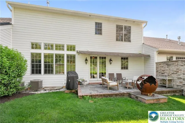 a house view with sitting space garden view with a seating space