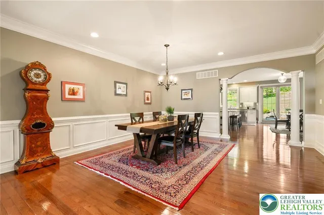 a living room with furniture a rug and white walls