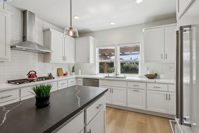 a kitchen with sink cabinets and window