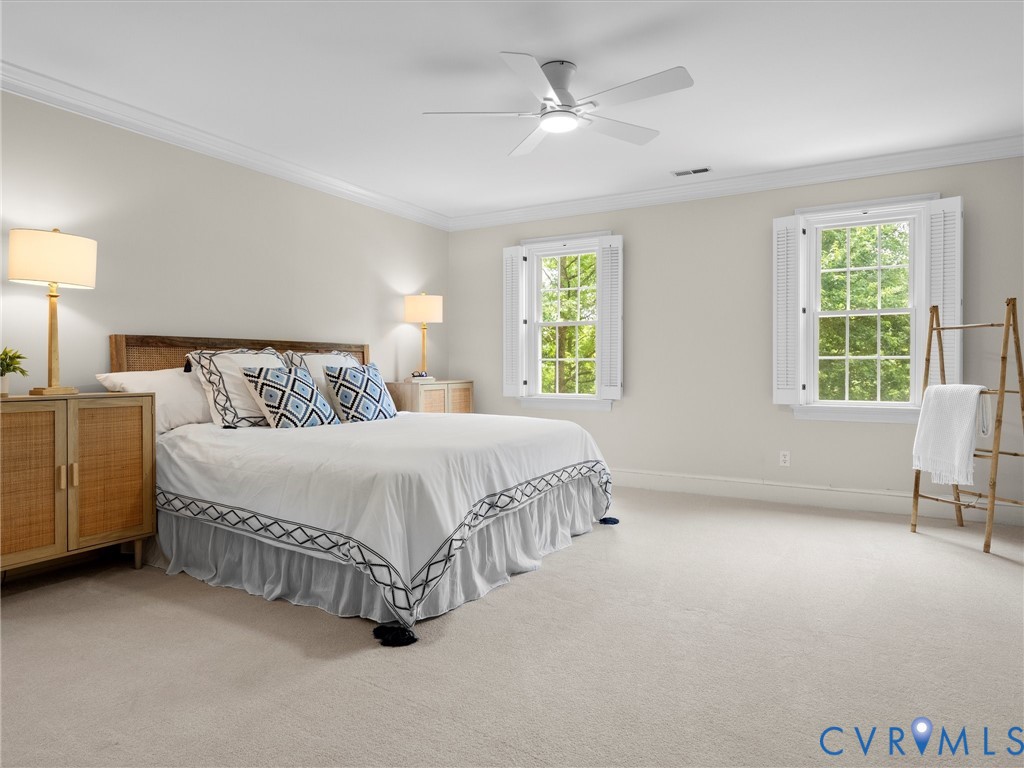 2011 Gamelaw Court Midlothian, VA 23113 - Photo 35 of 77 a spacious bedroom with a bed a table and chair