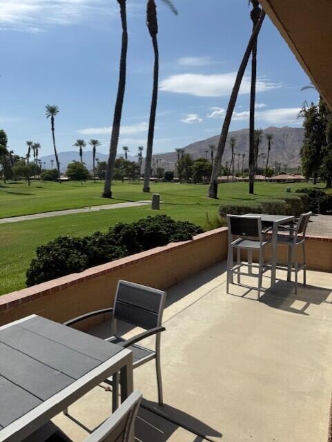 26 Sunrise Drive Rancho Mirage, CA 92270 - Photo 19 of 39 a roof deck with table and chairs