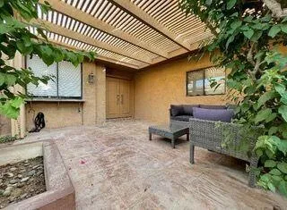 a backyard of a house with seating space