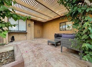 26 Sunrise Drive Rancho Mirage, CA 92270 - Photo 3 of 39 a backyard of a house with seating space