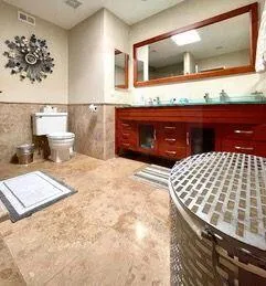 a bedroom with a bed and a dresser
