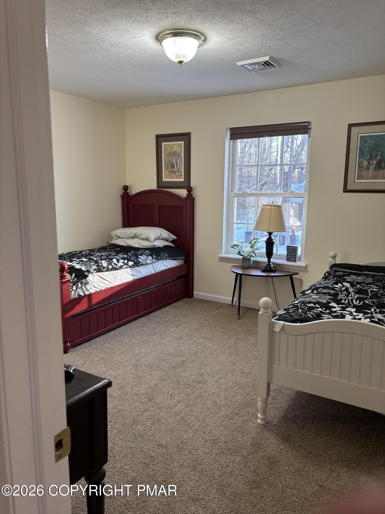 3222 Beech Ridge Drive Pocono Summit, PA 18346 - Photo 15 of 20 a bedroom with furniture and a window