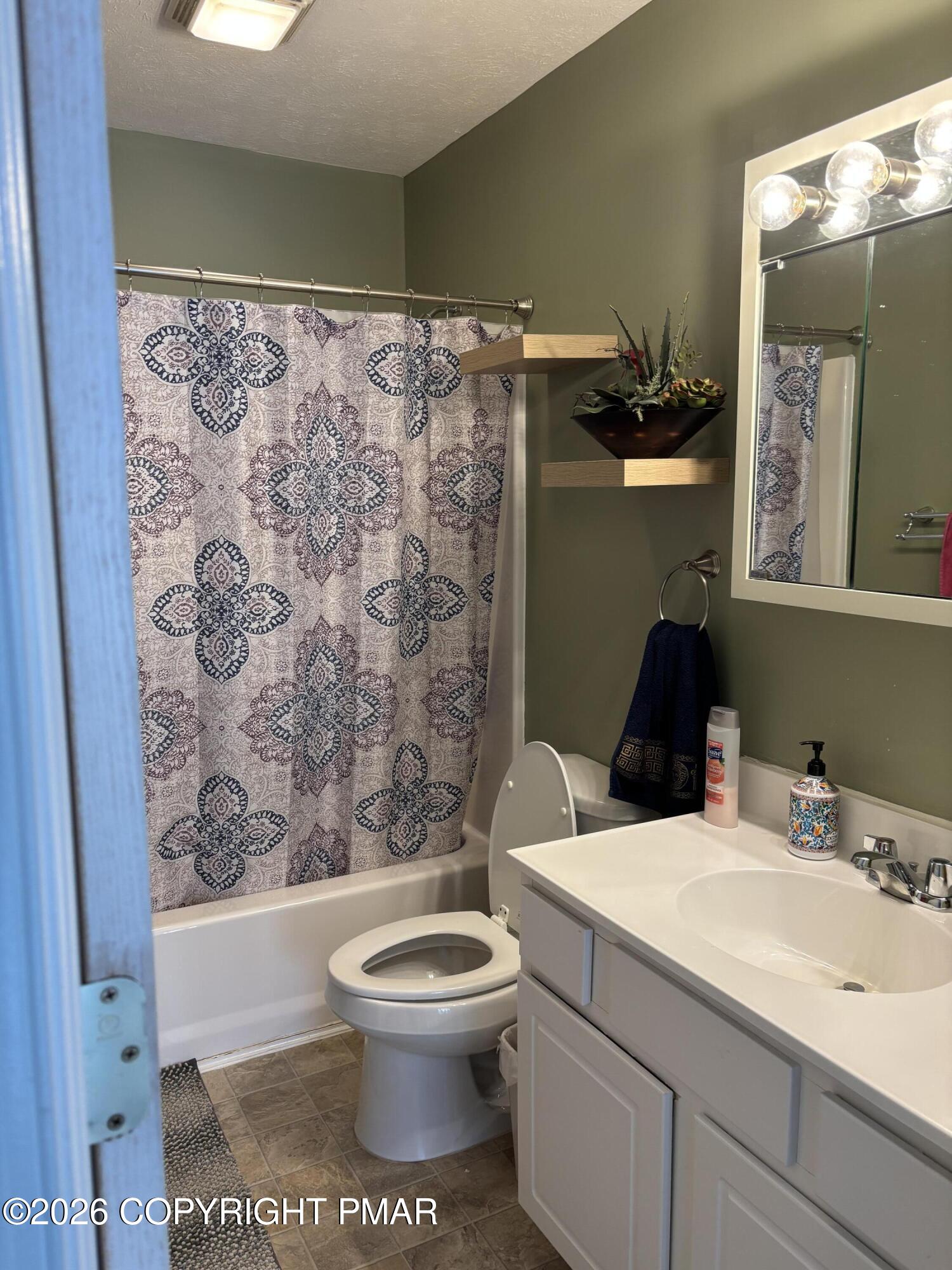 3222 Beech Ridge Drive Pocono Summit, PA 18346 - Photo 16 of 20 a bathroom with a toilet sink and shower