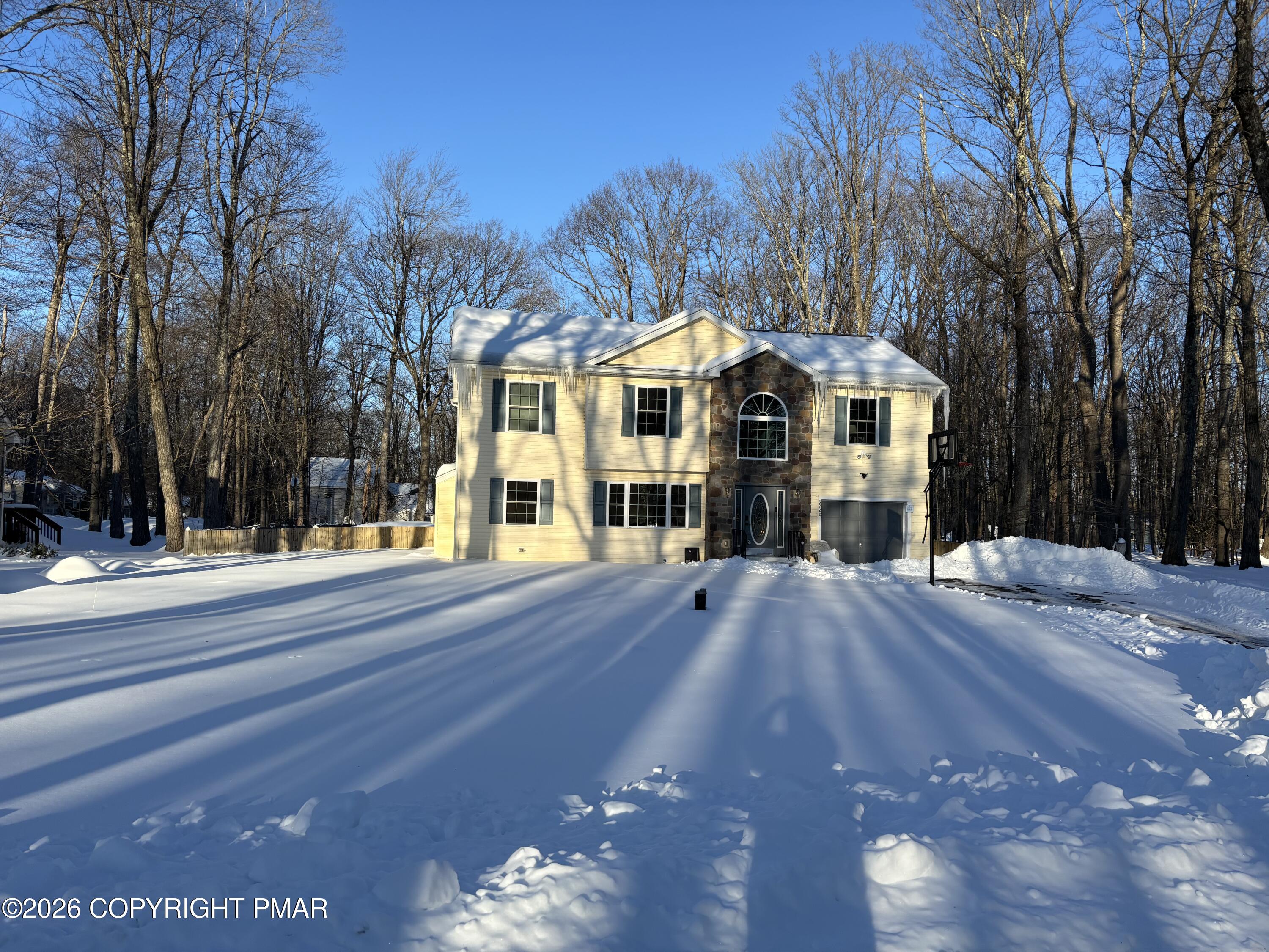 3222 Beech Ridge Drive Pocono Summit, PA 18346 - Photo 2 of 20 a view of a building with a street