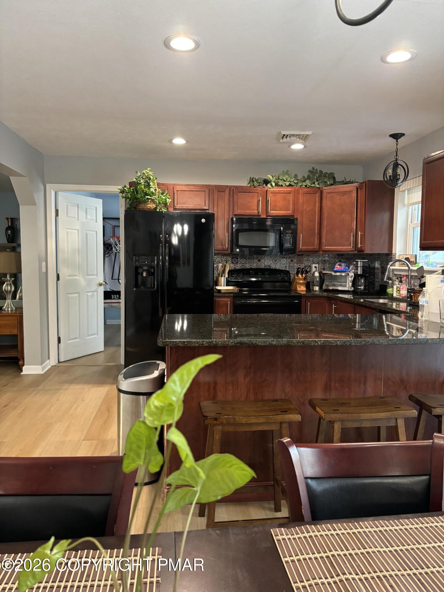 3222 Beech Ridge Drive Pocono Summit, PA 18346 - Photo 7 of 20 a living room with a couch and a fireplace