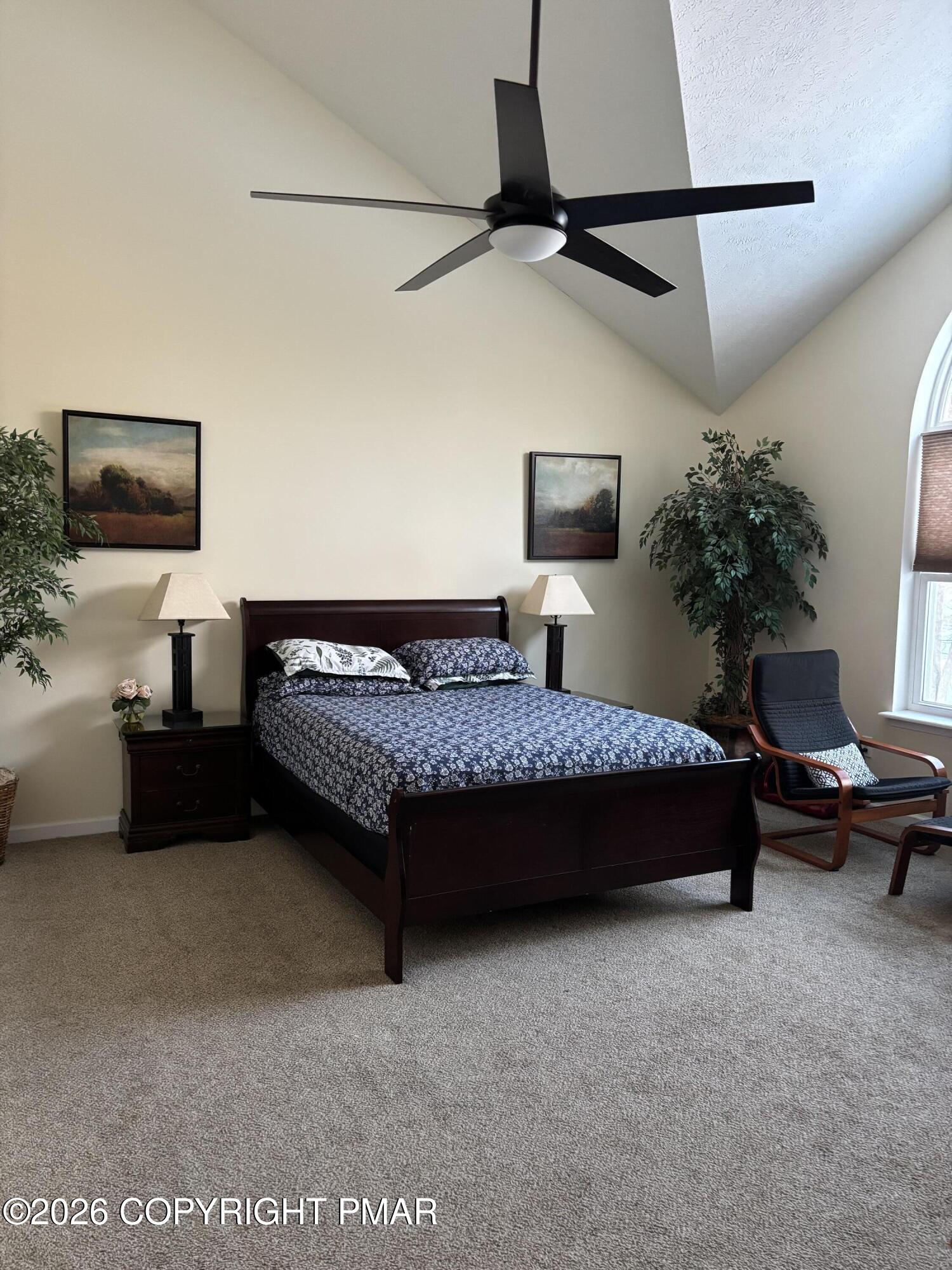 3222 Beech Ridge Drive Pocono Summit, PA 18346 - Photo 9 of 20 a spacious bedroom with a bed and a chair