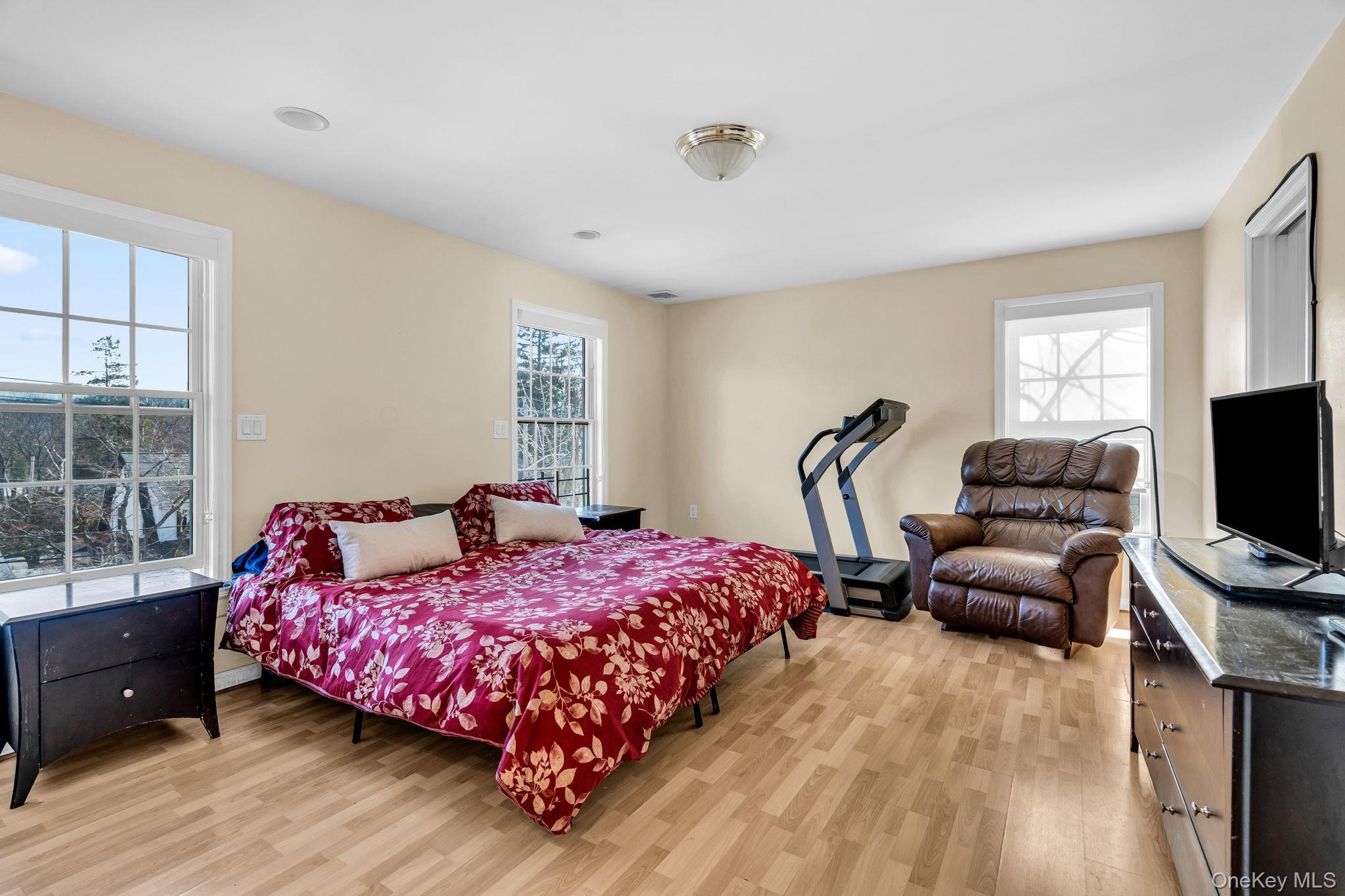 27 Overlook Road White Plains, NY 10605 - Photo 17 of 28 a bedroom with a bed and a flat screen tv
