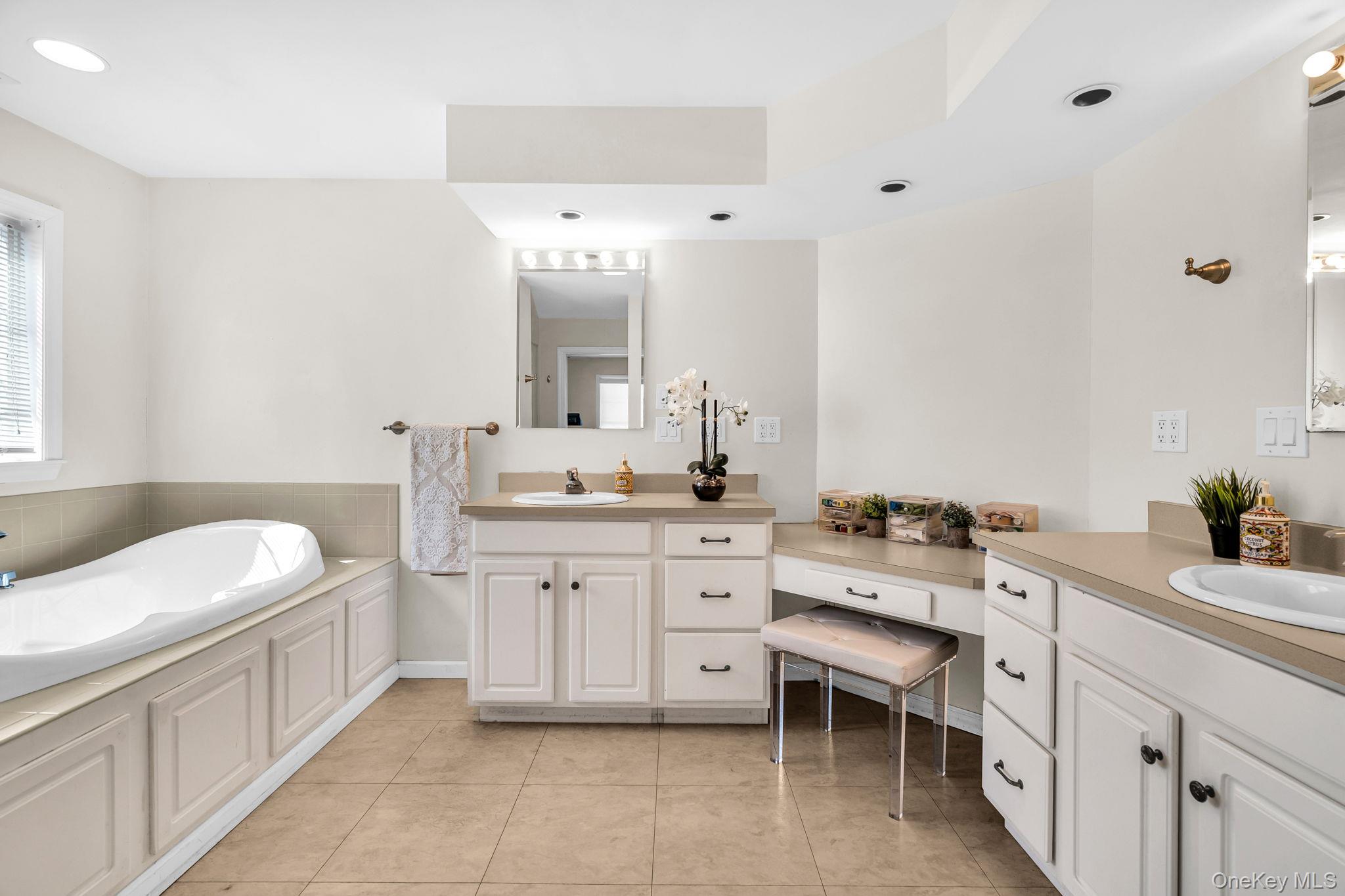 27 Overlook Road White Plains, NY 10605 - Photo 18 of 28 a spacious bathroom with a granite countertop sink mirror and a