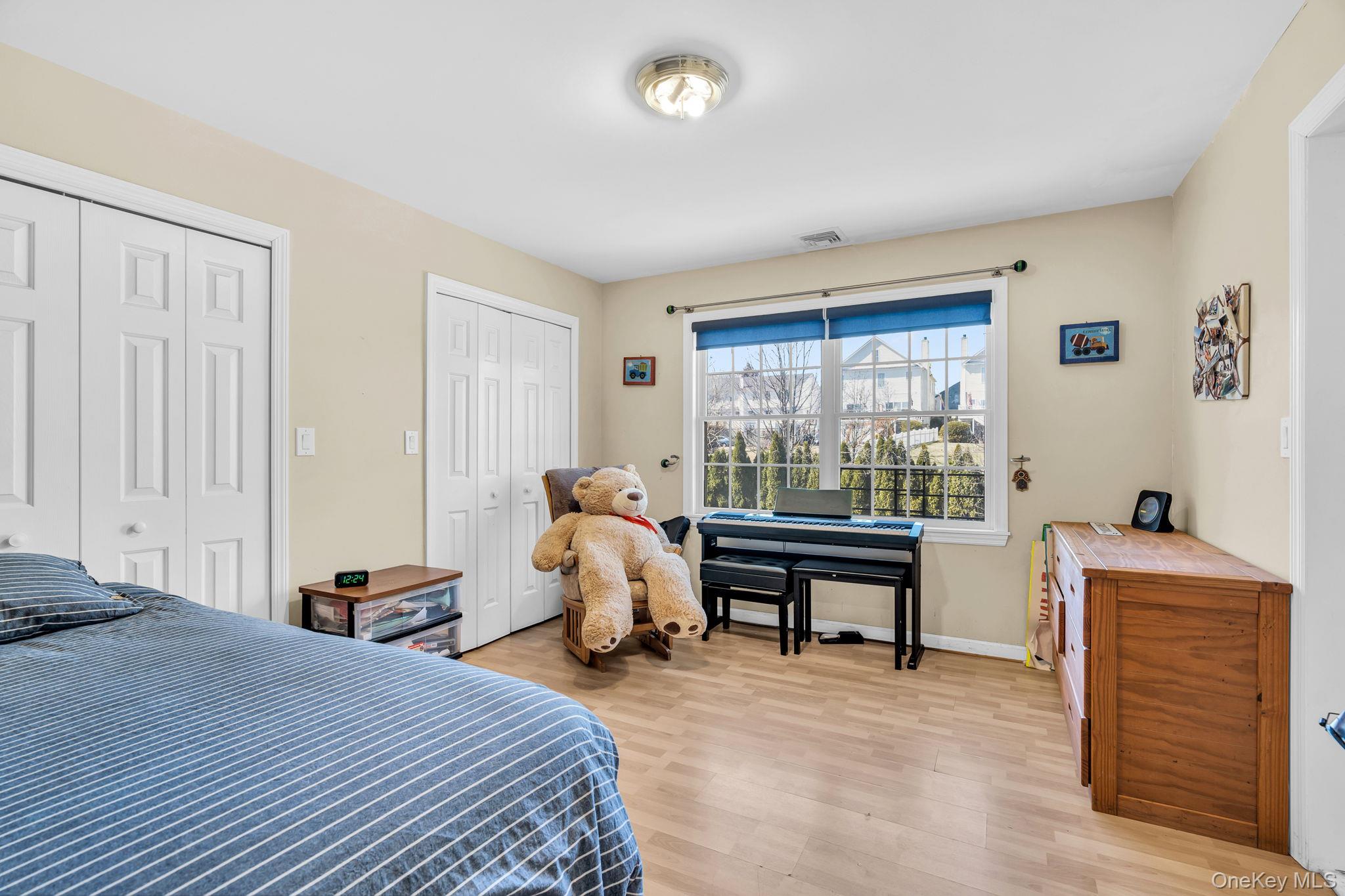27 Overlook Road White Plains, NY 10605 - Photo 22 of 28 a bedroom with a bed and a dresser