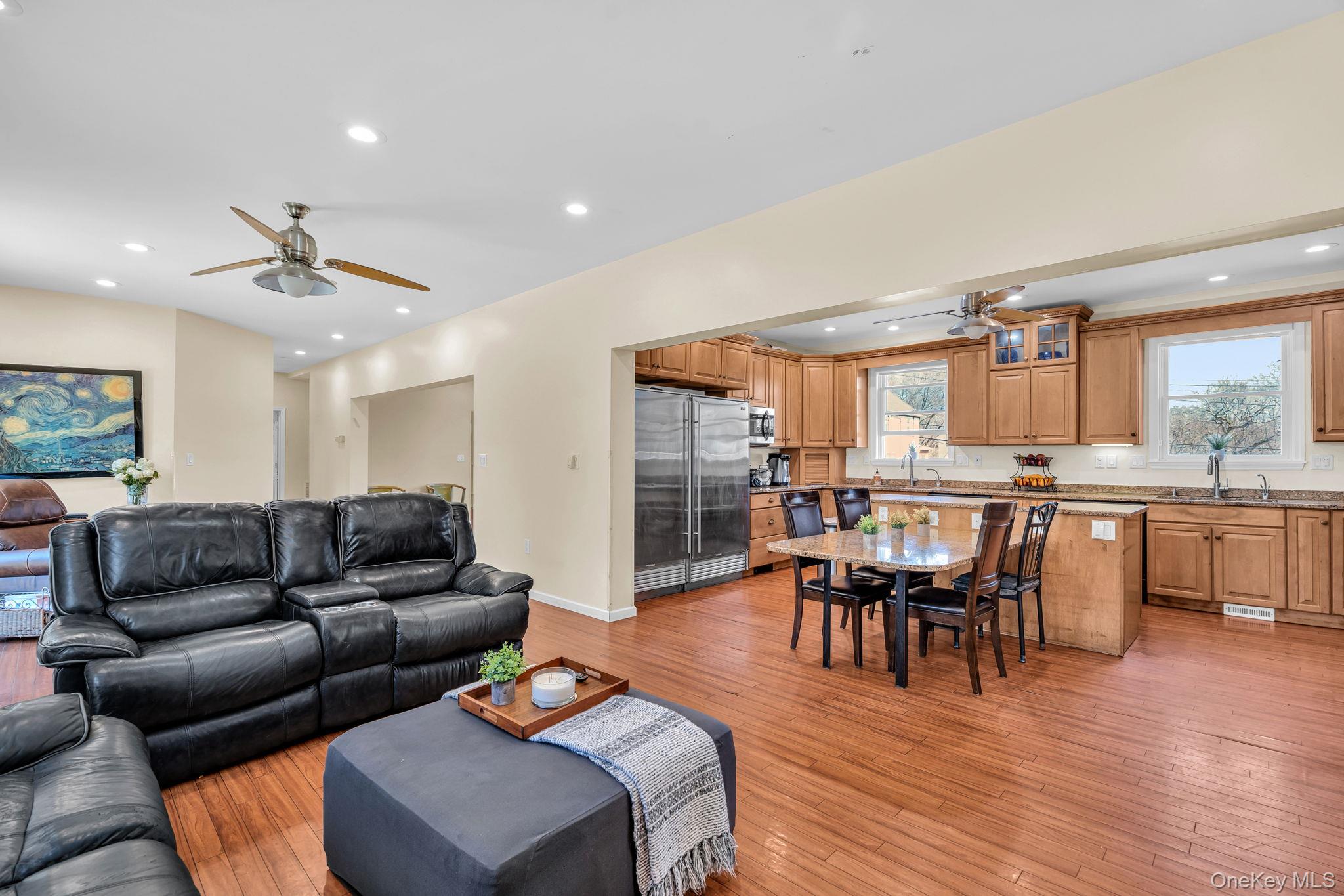 27 Overlook Road White Plains, NY 10605 - Photo 6 of 28 a living room with furniture a wooden floor and a kitchen view