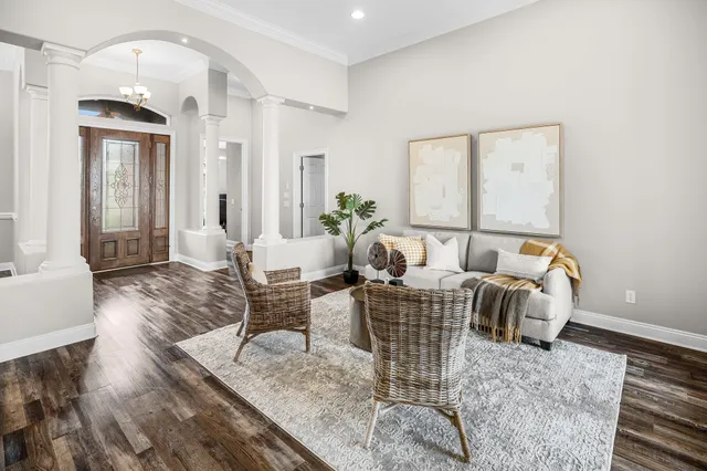 a kitchen with stainless steel appliances granite countertop a sink a stove and a wooden cabinets