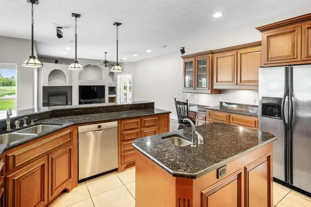 a bedroom with a bed mirror and a large window