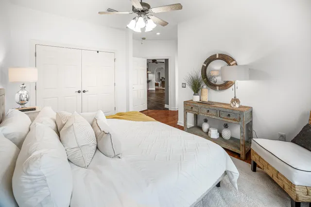 a bedroom with a bed and a chandelier